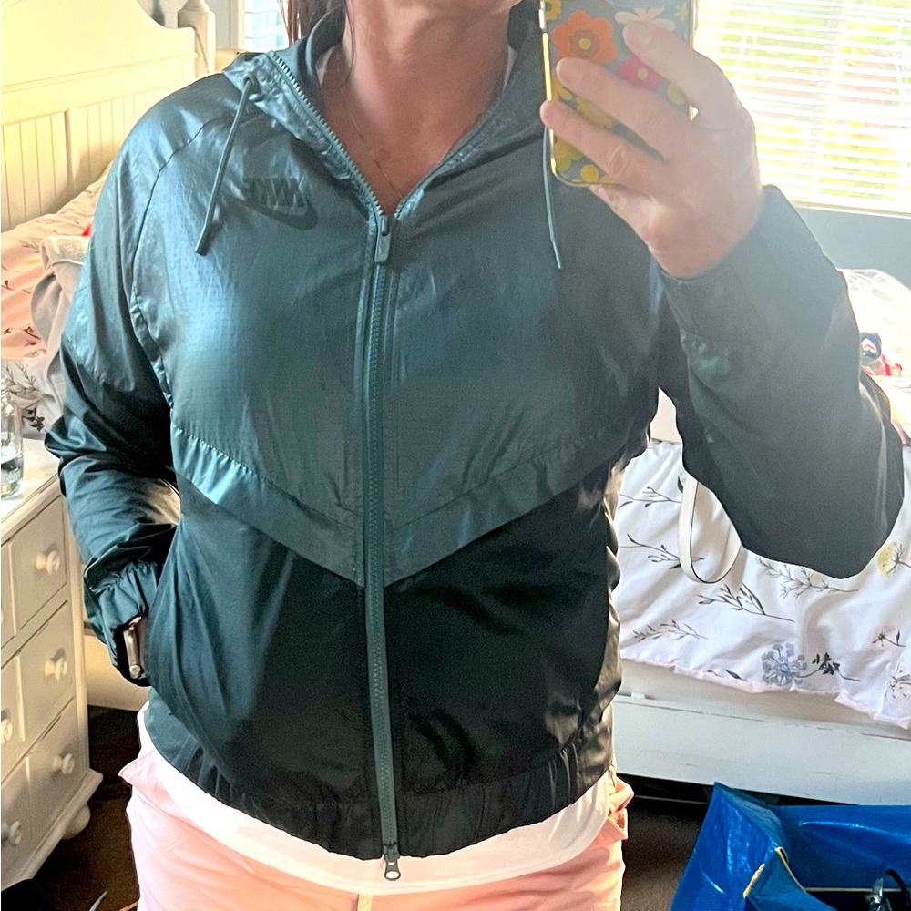 Nike teal hooded, wind breaker. Vented at back Size Medium. Excellent condition
